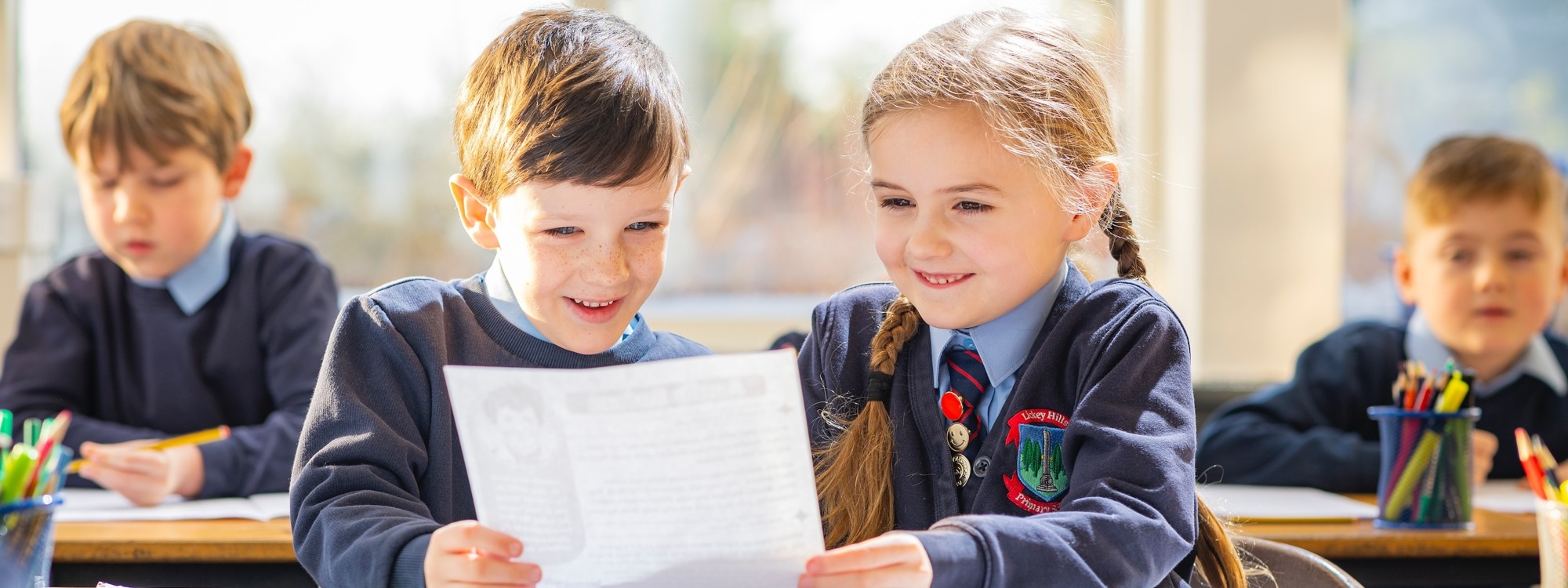 Lickey Hills School pupils reading document together