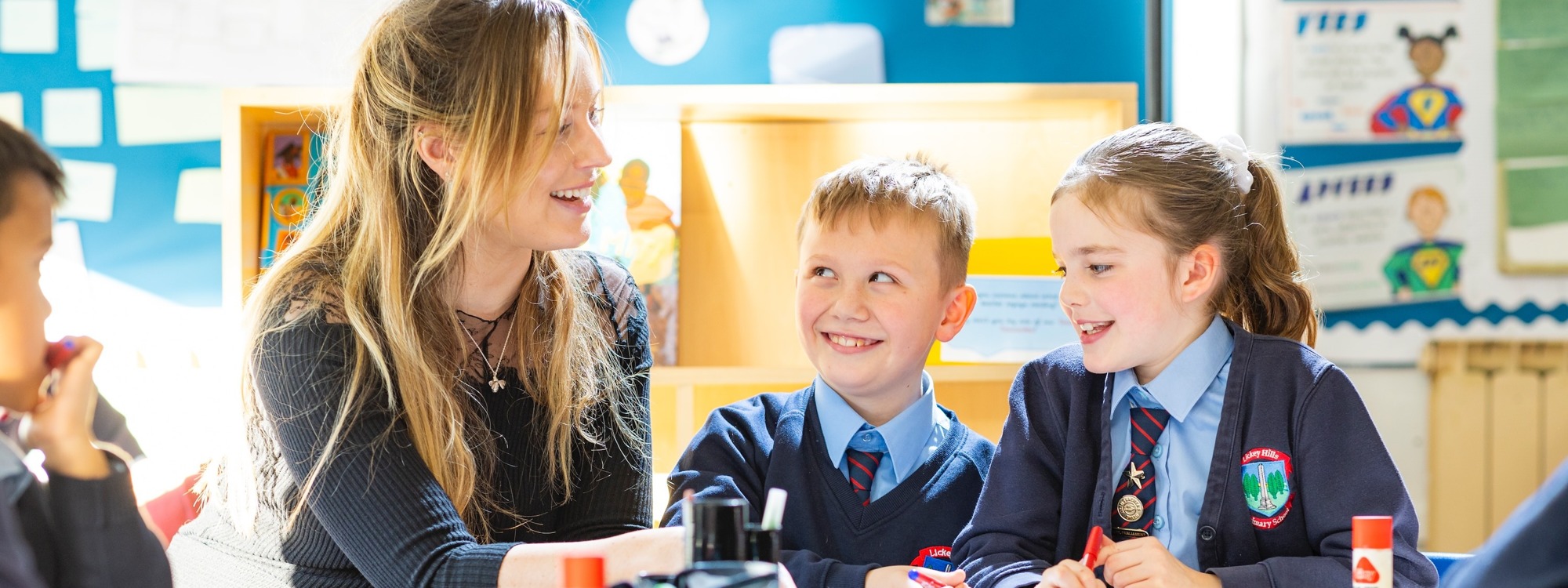 Lickey Hills School pupils chatting with teacher in class