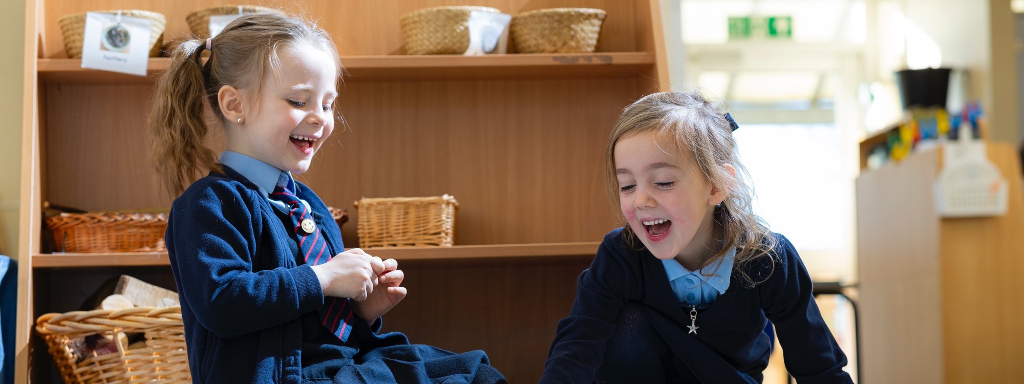 Lickey Hills School pupils sitting looking at objects on a mat